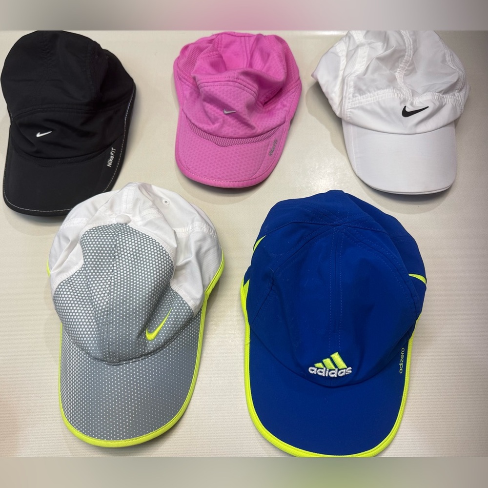 Collection of Nike and Adidas hats